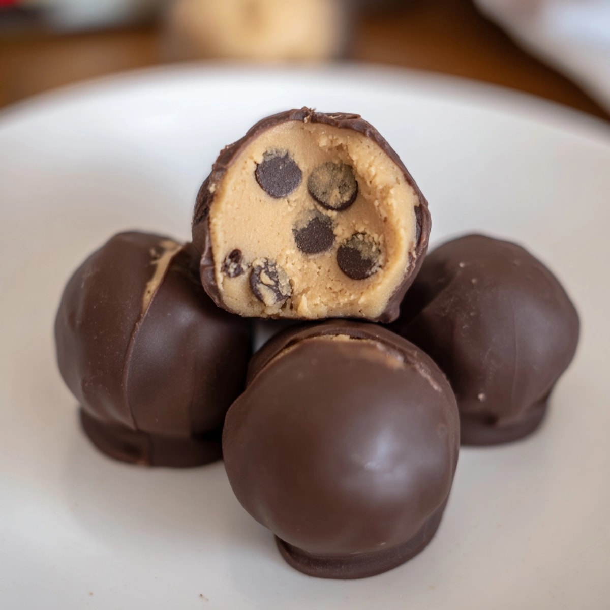 Creamy, irresistible Cookie Dough Bites, loaded with chocolate chips and encased in a crisp shell.