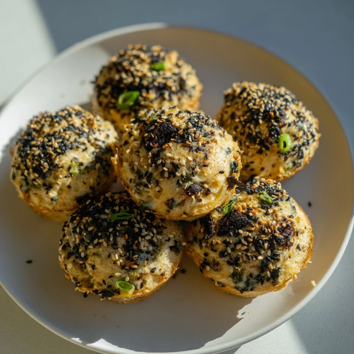 Savory Japanese Furikake Mushroom Muffins topped with sesame seeds, perfect for breakfast.