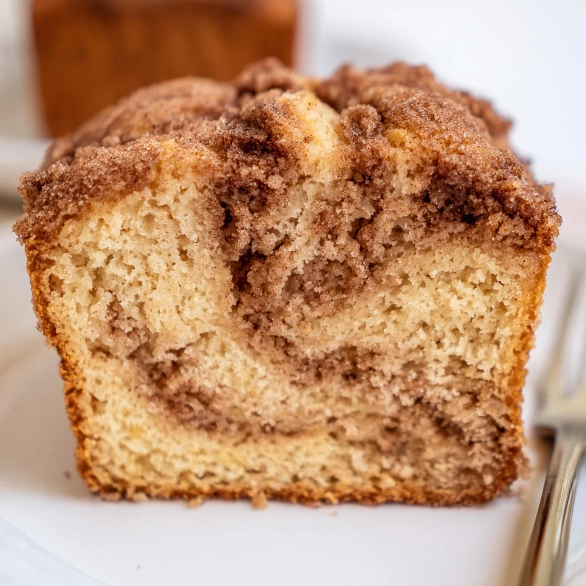Moist cinnamon sugar maple bourbon pancake muffin loaf, perfect for breakfast or snacks.