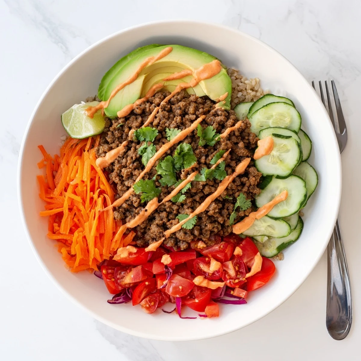 Colorful Plant-Based Meat Bowl garnished with fresh vegetables and lime slices.  