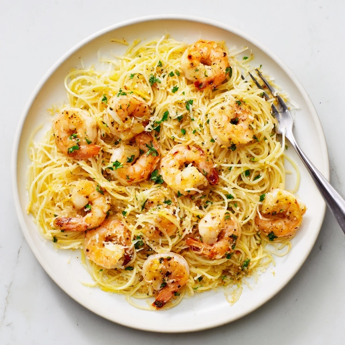 Golden shrimp nestle in flavorful lemon garlic sauce in this stunning one-skillet pasta.
