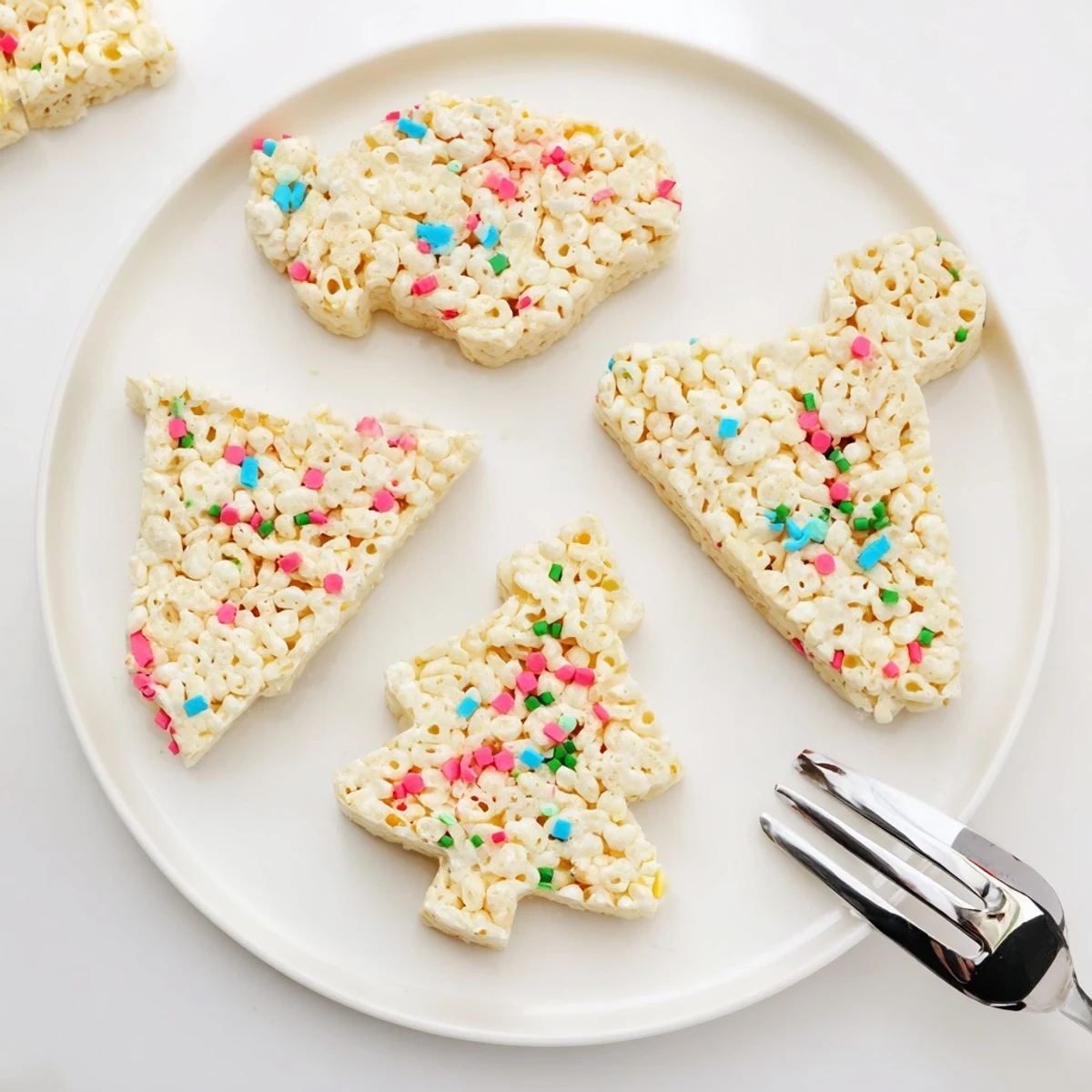 Festive Cookie Cutter Shaped Rice Krispies Treats, adorned with sprinkles; a sweet treat for any occasion.