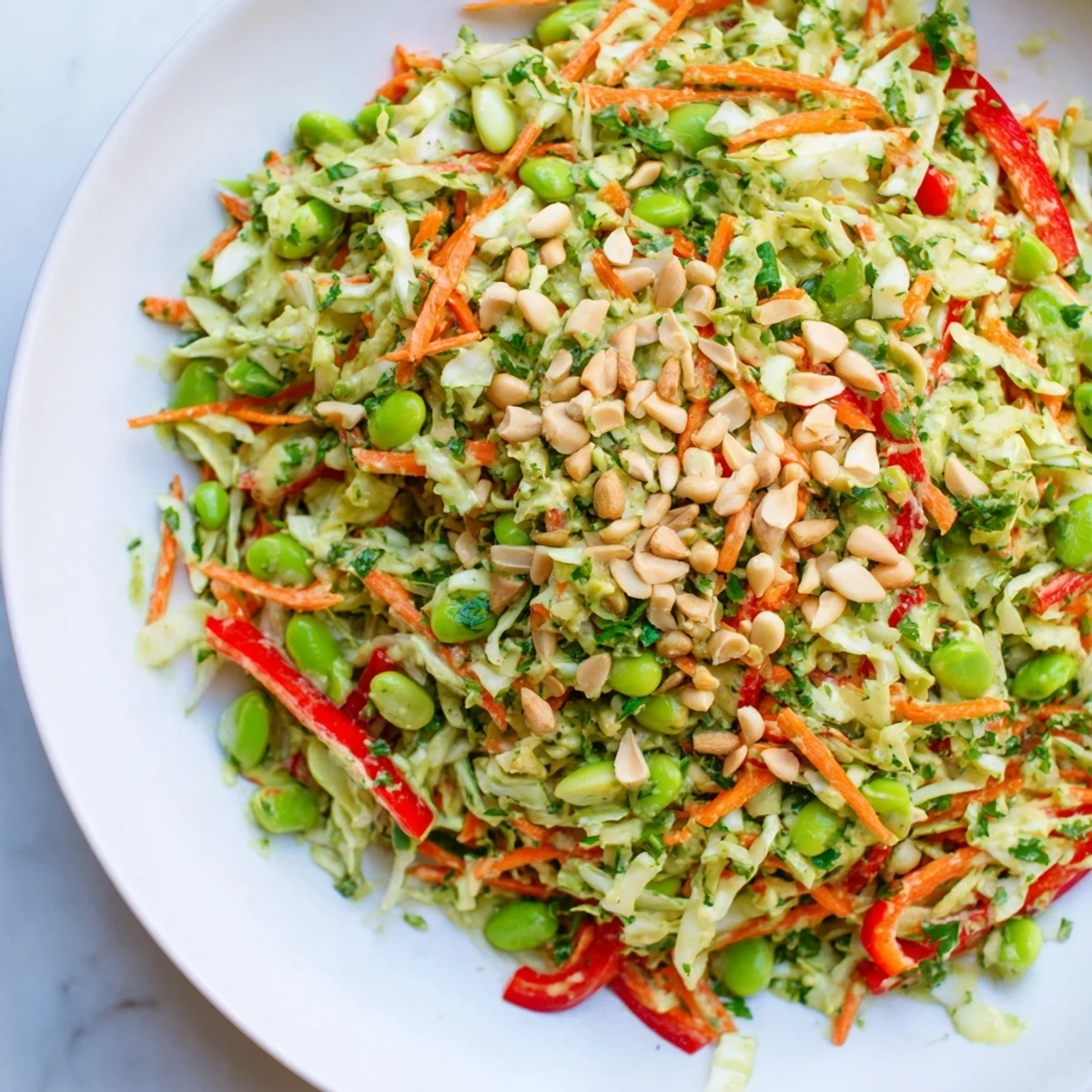Fresh, vibrant Crunchy Cabbage and Edamame Salad; a colorful bowl with crunchy toppings ready to serve.