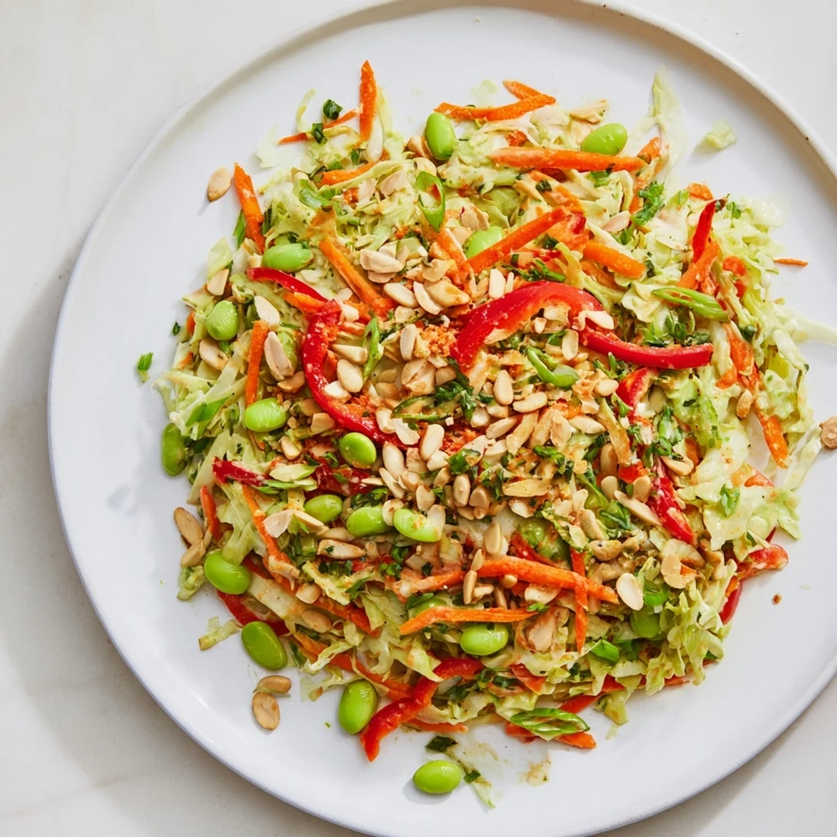 Perfectly plated Crunchy Cabbage and Edamame Salad, featuring tender edamame and a creamy green dressing.