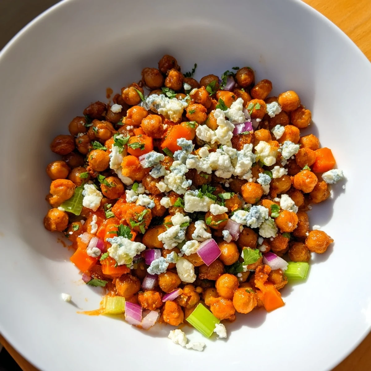 Cool, crunchy bite of Buffalo Chicken Bean Salad, featuring savory chickpeas, fresh veggies, and a tangy buffalo dressing.