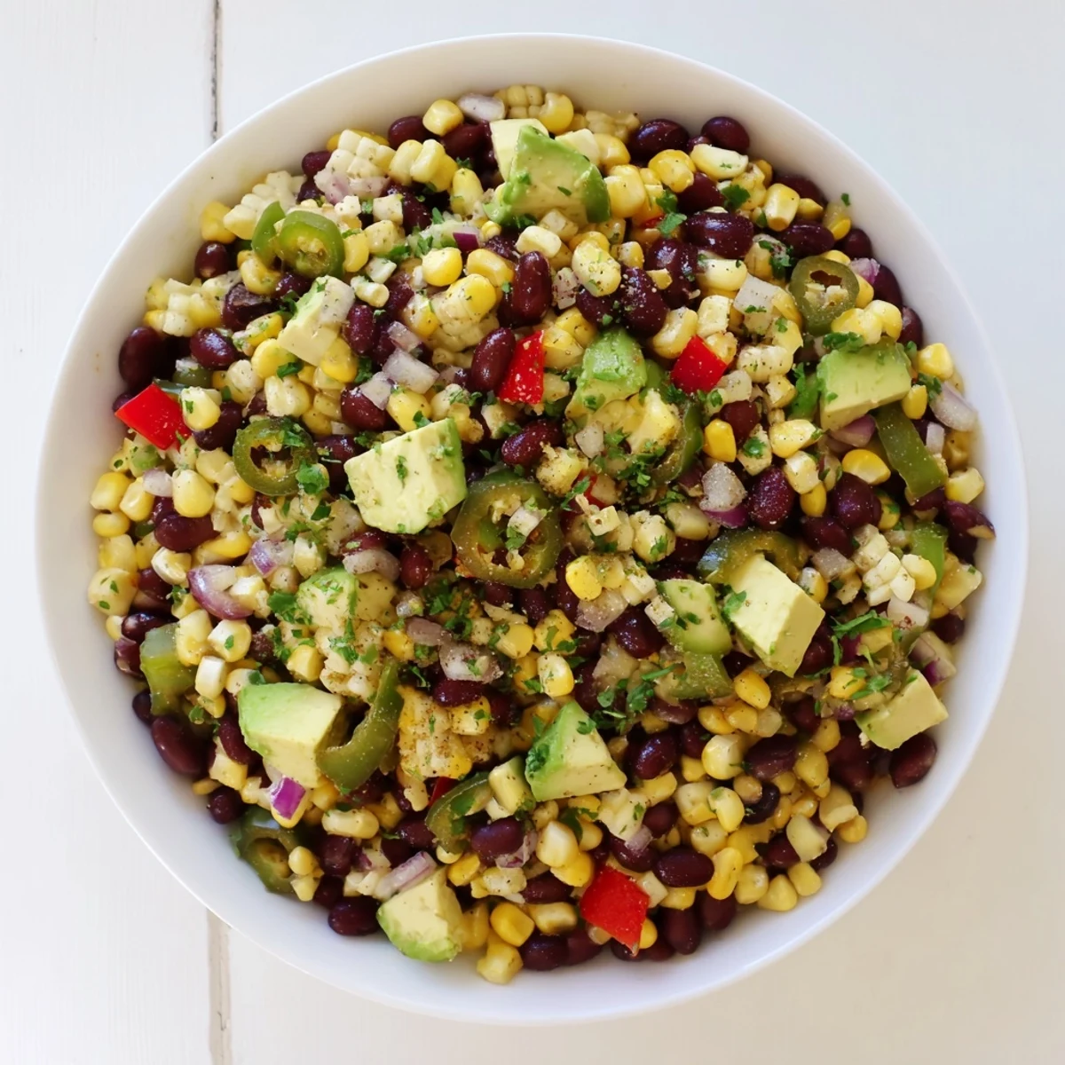 Vibrant Southwestern Black Bean and Corn Salad, a colorful mix with fresh cilantro, ready to eat.