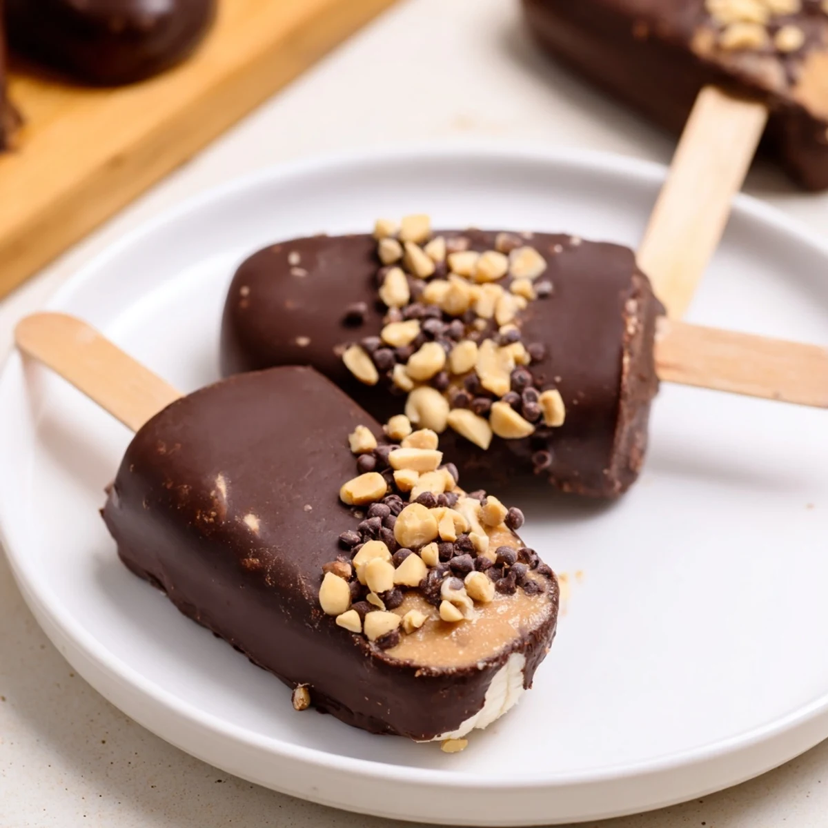 Frozen Banana Chocolate Pops: A close-up of creamy, chocolate-covered banana treats, perfect for a hot day.