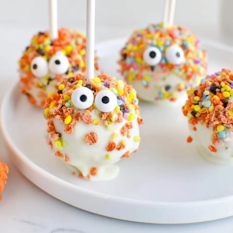 Flamin Hot Sweet Tea Monster Cake Pops decorated with colorful sprinkles and candy eyes.  