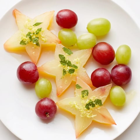 Vibrant sliced starfruit and grapes make a refreshing brunch fruit garnish, juicy and ready to enjoy.