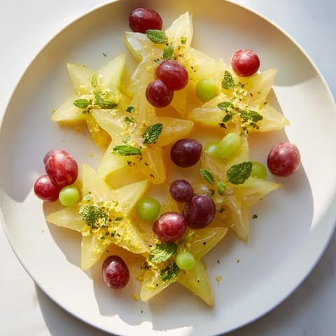 A beautiful display of fresh brunch fruit: starfruit, sliced grapes, ready for a healthy meal.