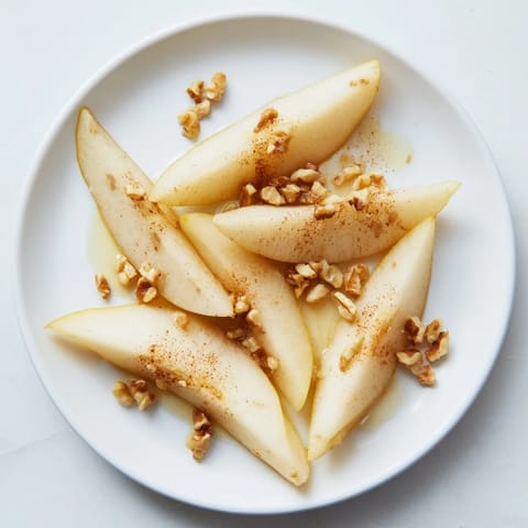 Thinly sliced pears with a drizzle of honey, ready for a quick, gluten-free snack.