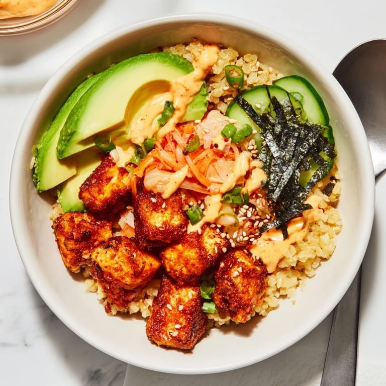 Vibrant crispy salmon rice bowl with fluffy rice and zesty spicy mayo drizzle.