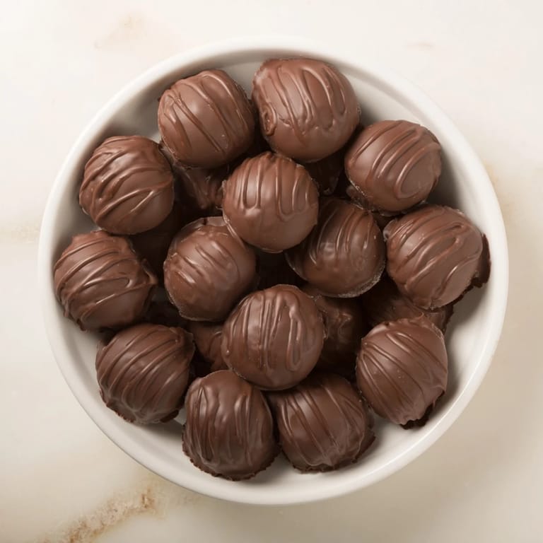 Homemade peanut butter buckeyes: beautiful, bite-sized candies with a smooth chocolate coating.