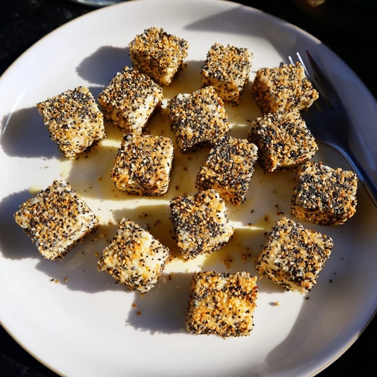 Close up shot of fresh everything bagel seasoning cheese cubes prepared and ready for tasting.