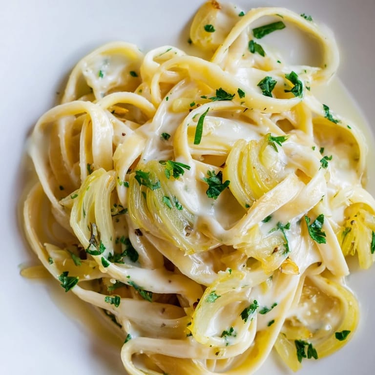 Up-close shot of a bowl filled with flavorful One-Pot French Onion Pasta, a cozy and delicious meal.